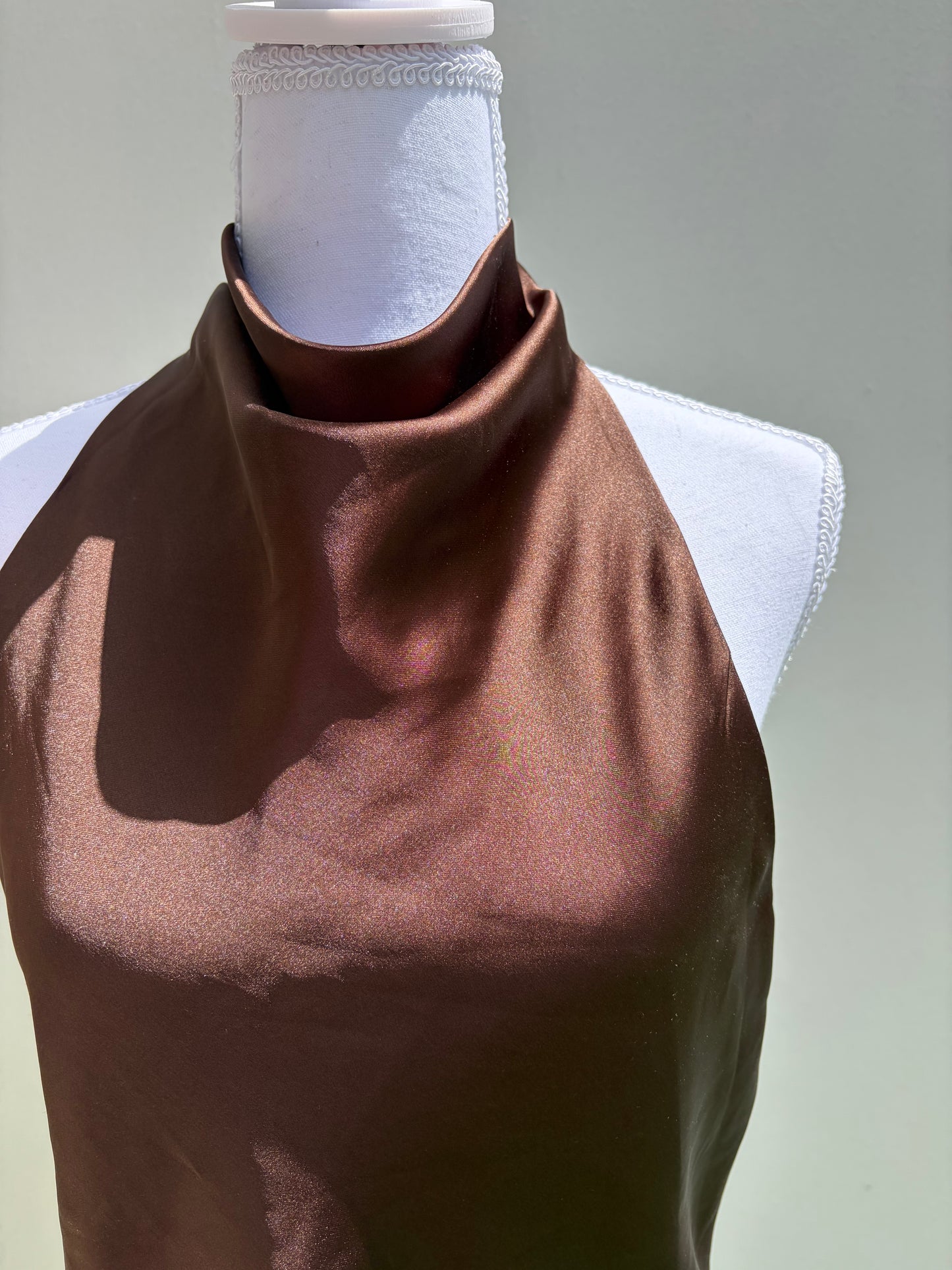 A sleek chocolate brown satin halter top