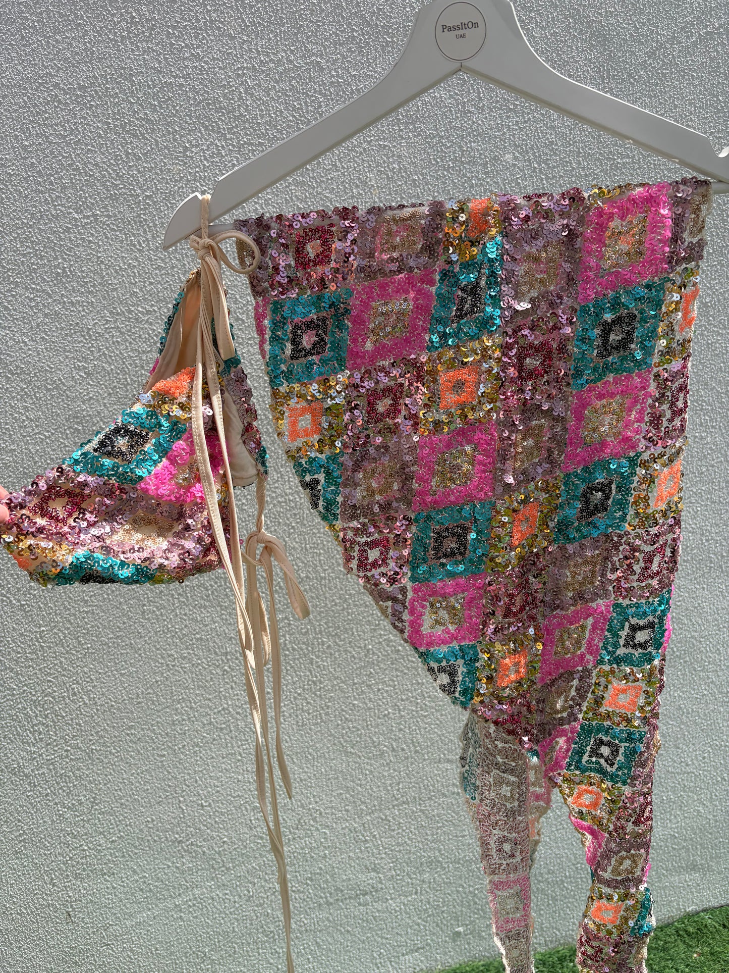 A vibrant three-piece sequin beach set