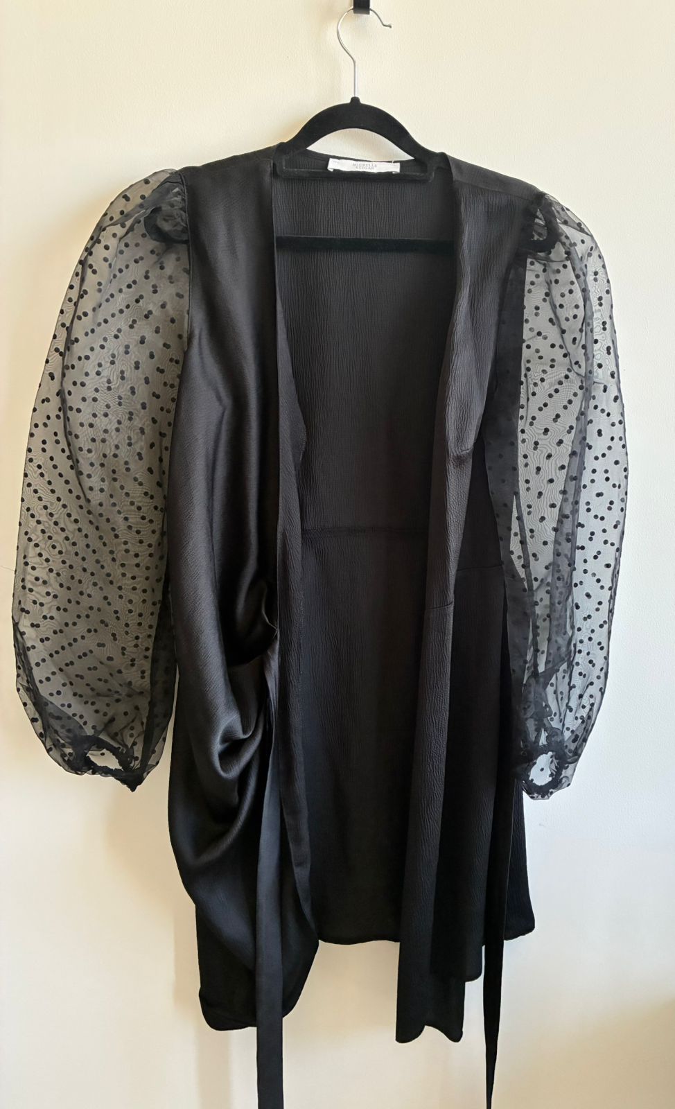 Michelle Keegan Black Wrap Dress with Sheer Polka Dot Sleeves