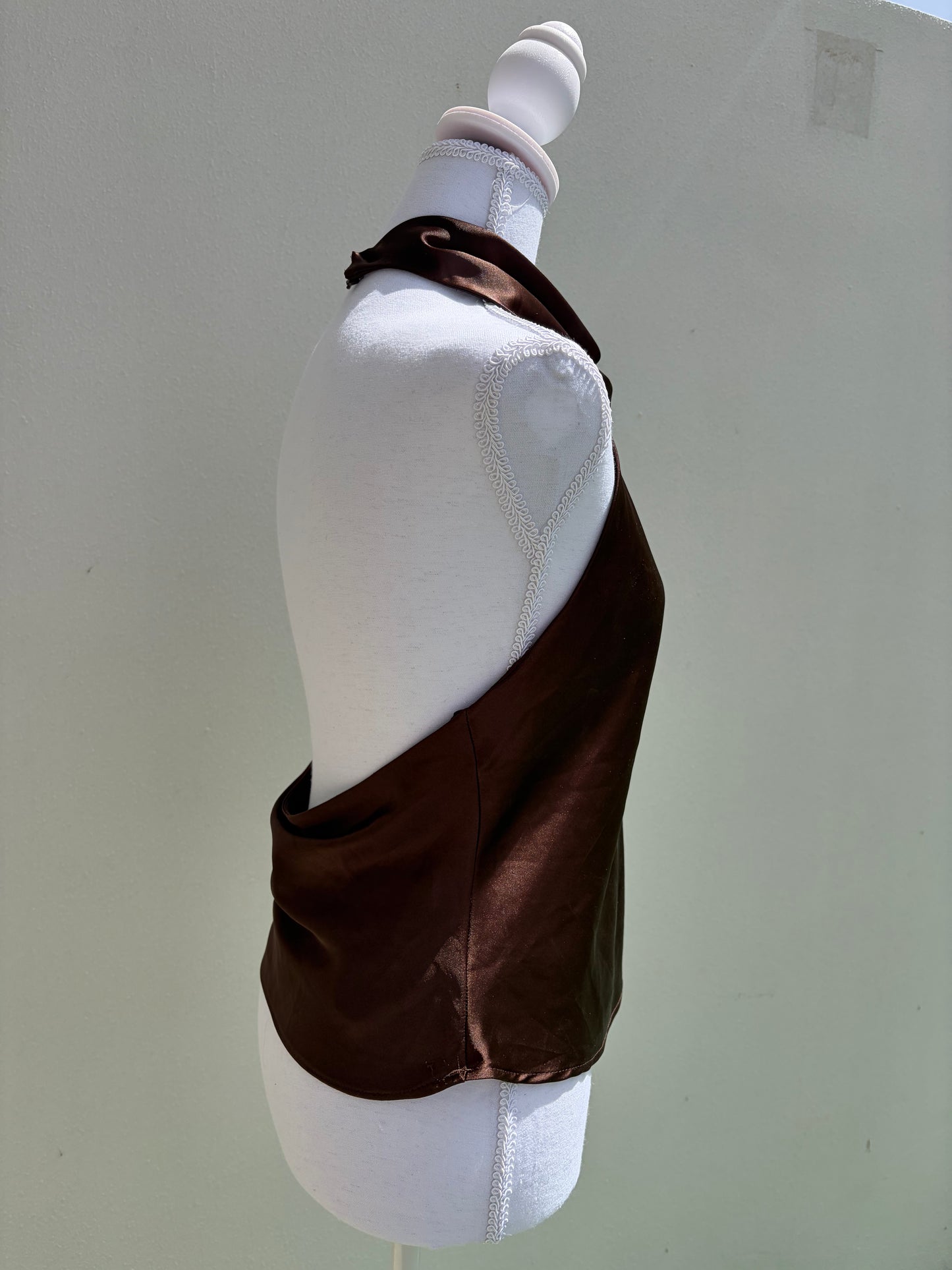 A sleek chocolate brown satin halter top