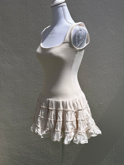 A flattering cream ribbed mini dress