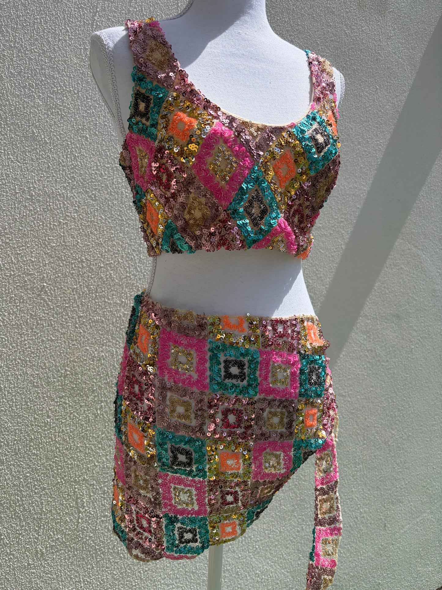 A vibrant three-piece sequin beach set