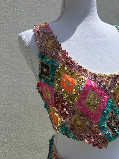 A vibrant three-piece sequin beach set