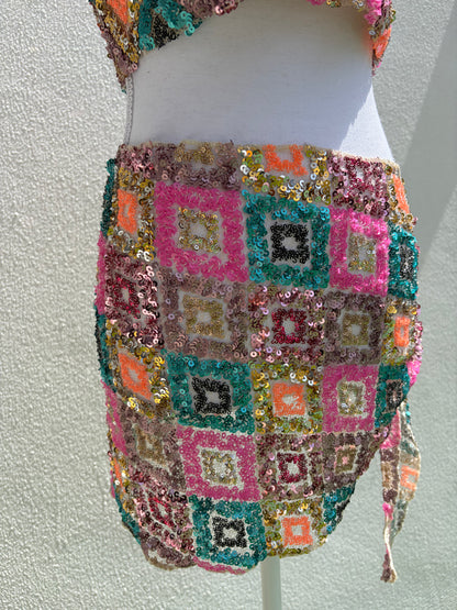 A vibrant three-piece sequin beach set